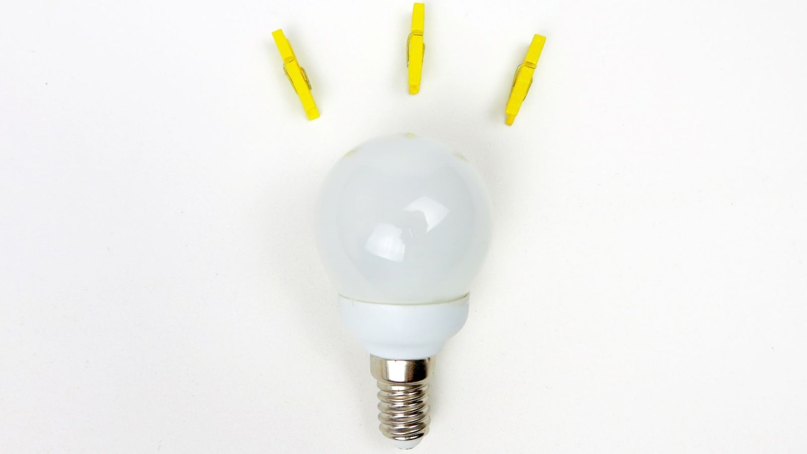 lightbulb with yellow clothespins on top